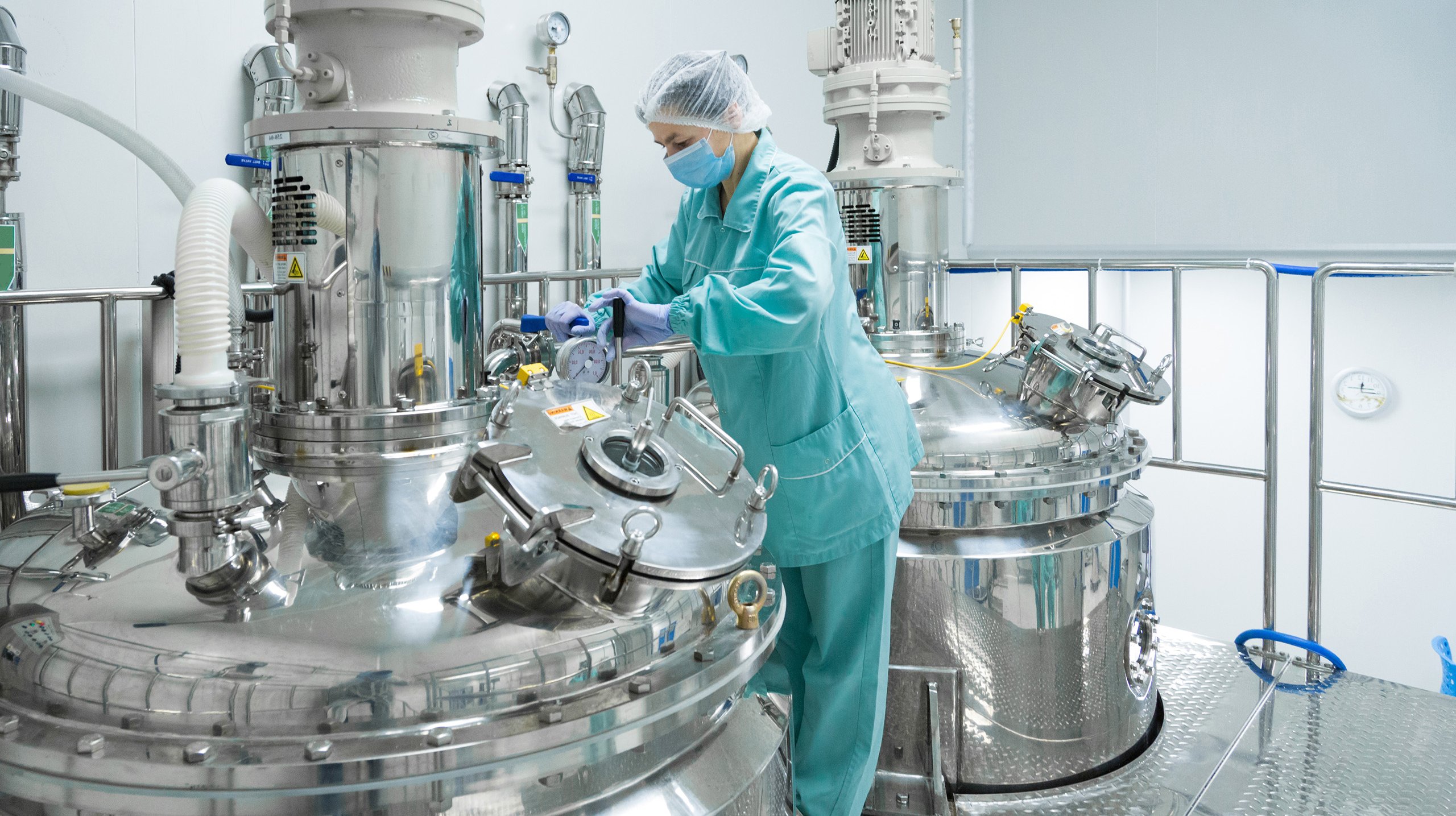 Pharmaceutical technician in sterile environment at pharmacy industry